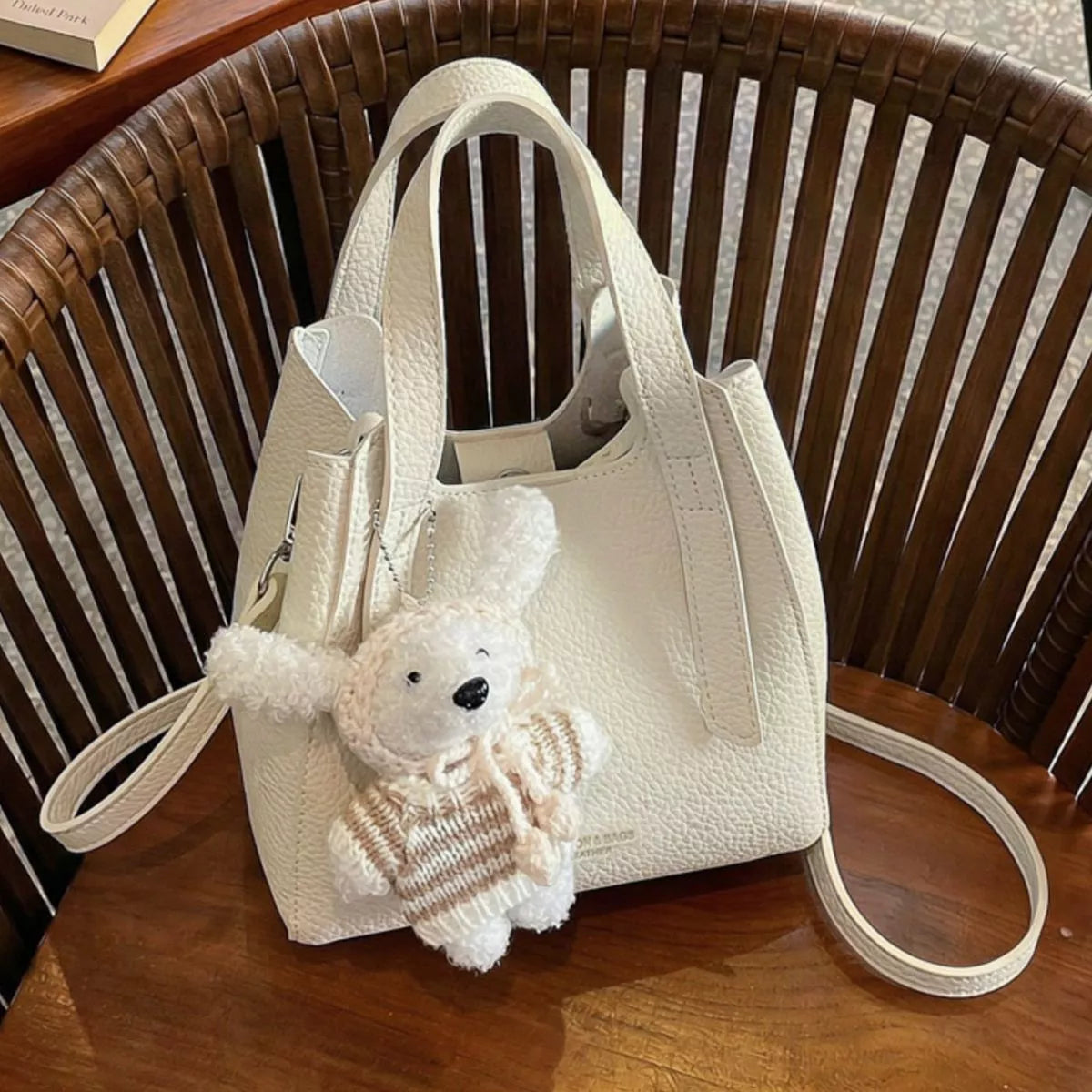 Chic Textured Leather Crossbody Bag with Adorable Charm