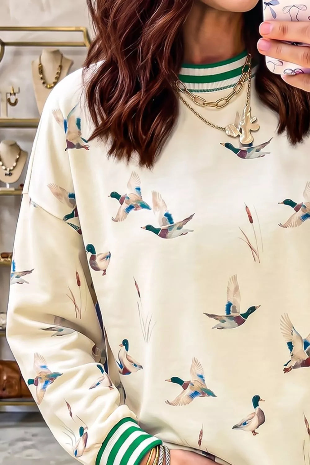 Whimsical Duck Print Sweatshirt with Striped Trim