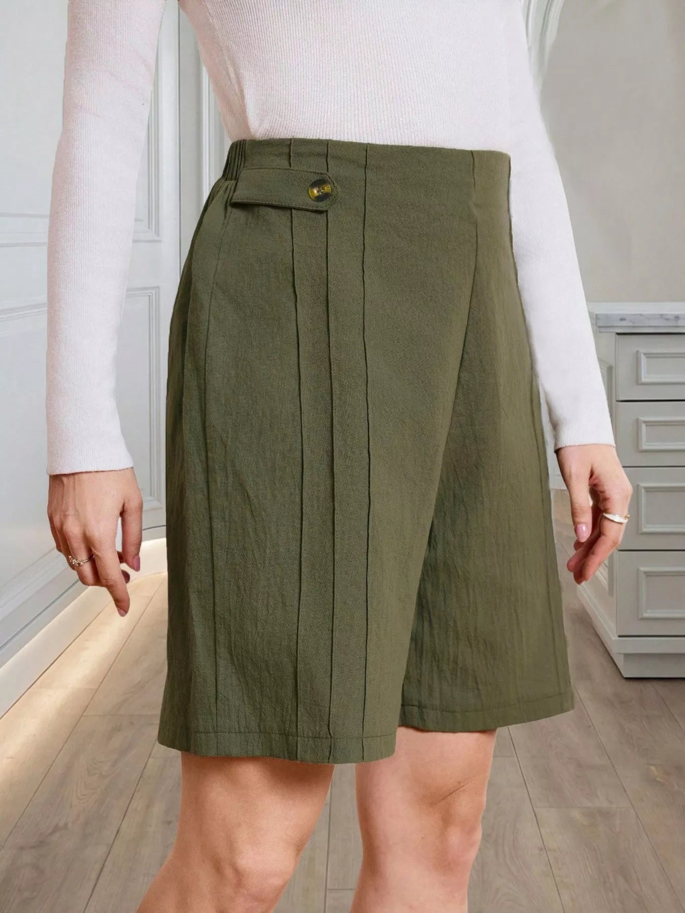 High-Waisted Pleated Shorts with Button Detail