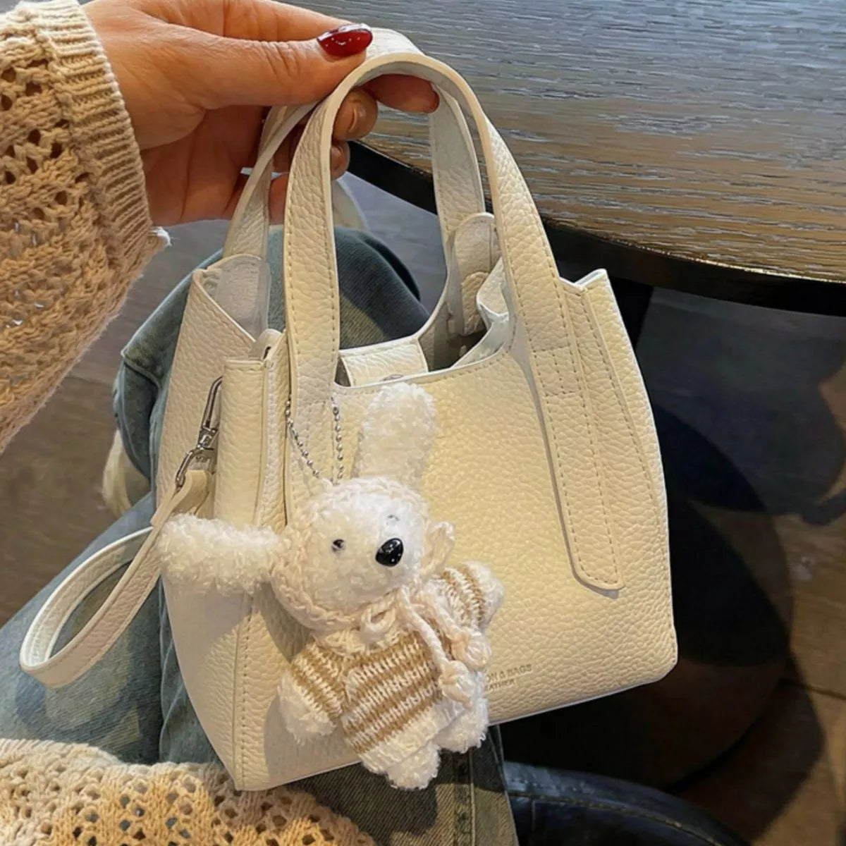 Chic Textured Leather Crossbody Bag with Adorable Charm