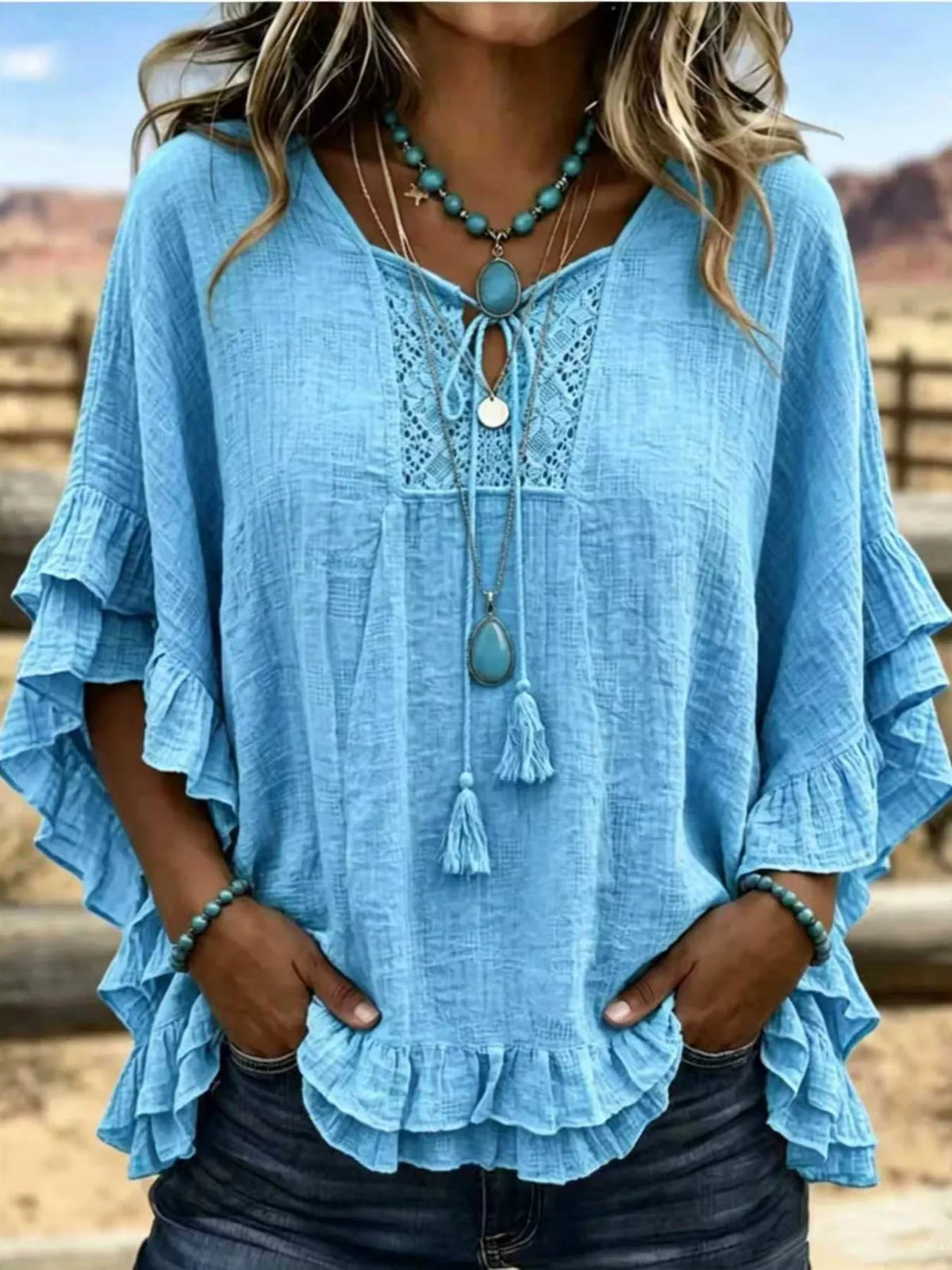 Full Size Tassel Tie Neck Ruffled Hem Blouse Plus Size
