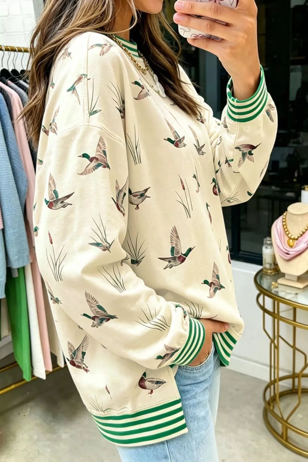 Whimsical Duck Print Sweatshirt with Striped Trim