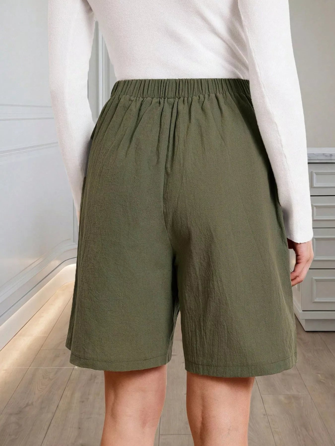 High-Waisted Pleated Shorts with Button Detail