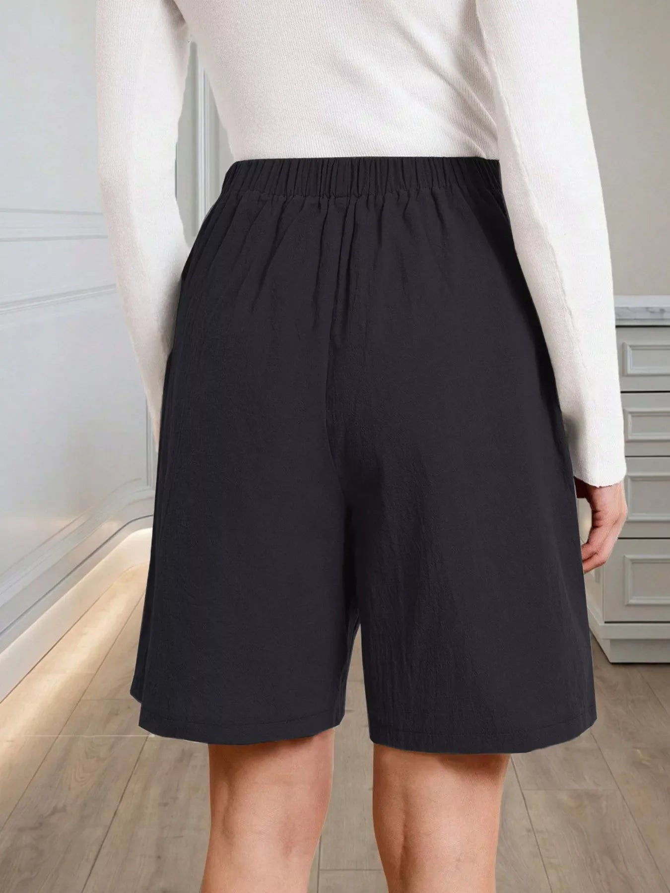High-Waisted Pleated Shorts with Button Detail
