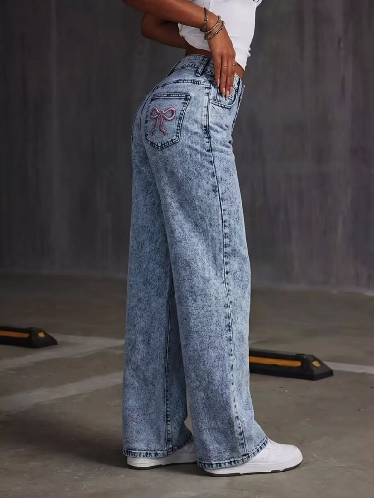 Washed Wide Leg Jeans with Embroidered Bow Detail