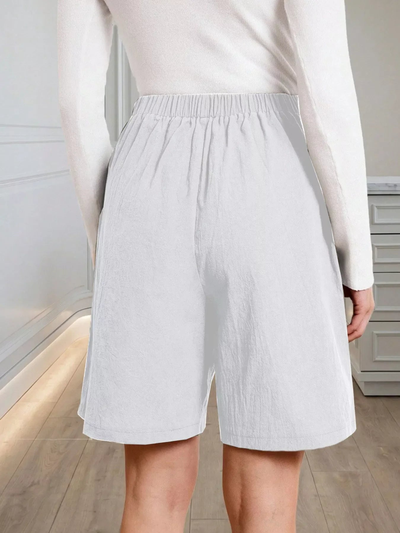 High-Waisted Pleated Shorts with Button Detail
