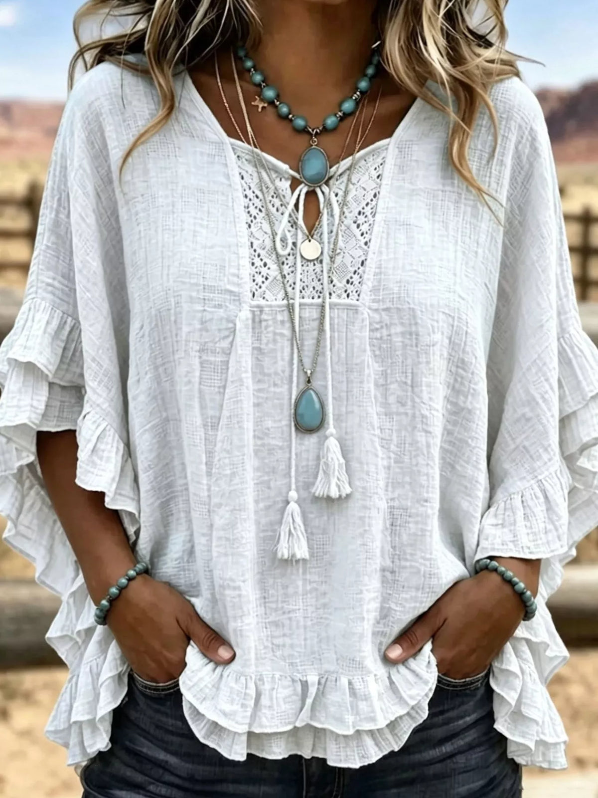 Full Size Tassel Tie Neck Ruffled Hem Blouse Plus Size