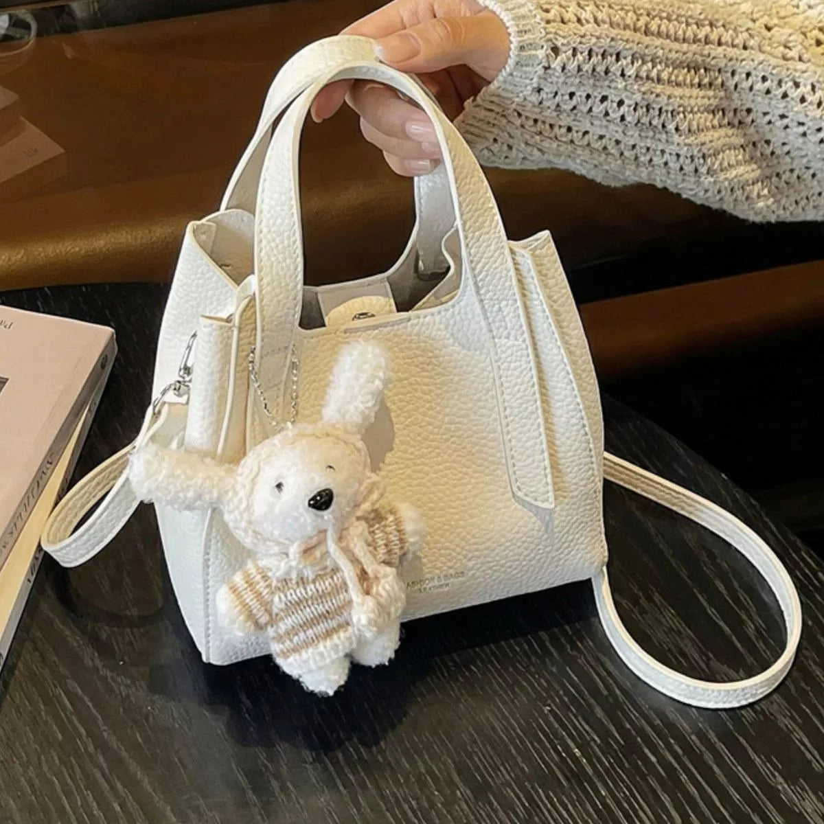 Chic Textured Leather Crossbody Bag with Adorable Charm